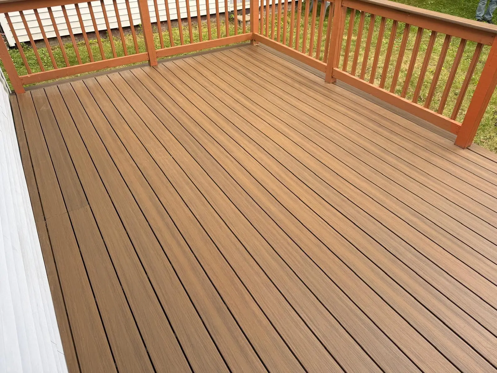 Completed composite deck surface and railing