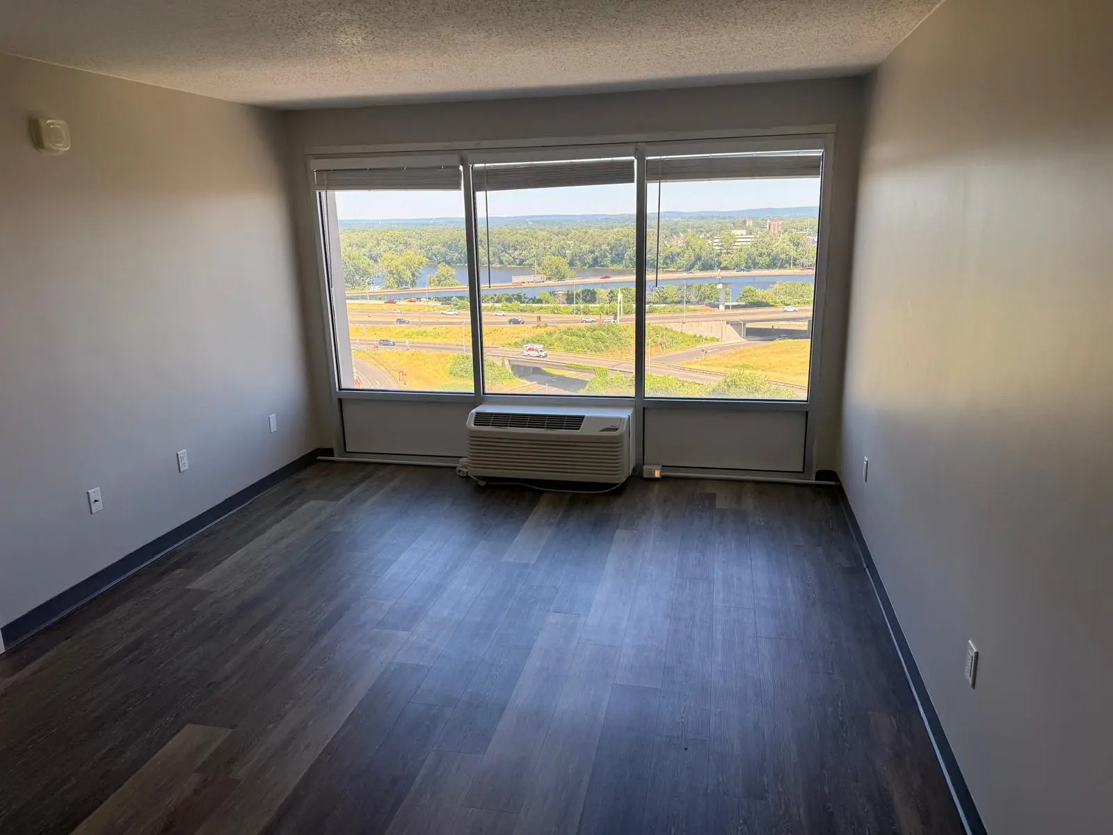 Finished gray vinyl plank flooring in a bright room