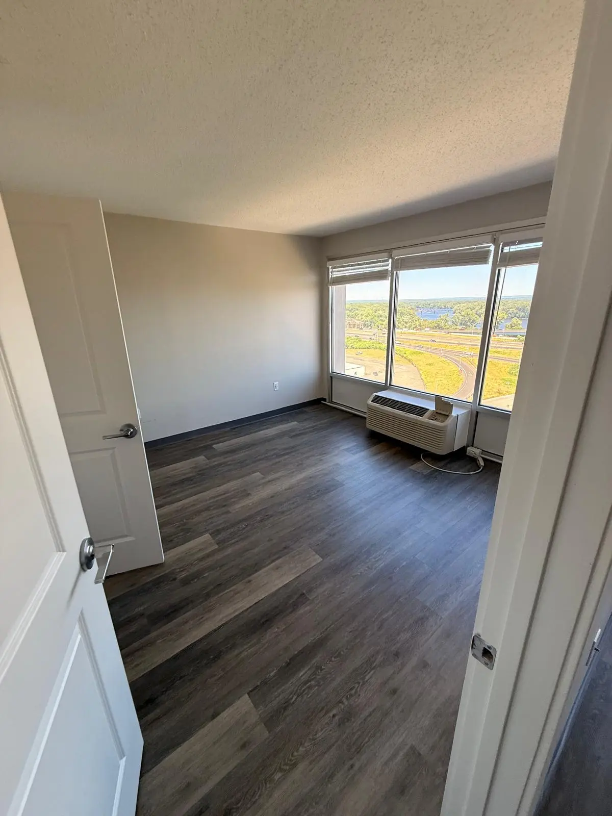 Completed flooring installation viewed through a doorway