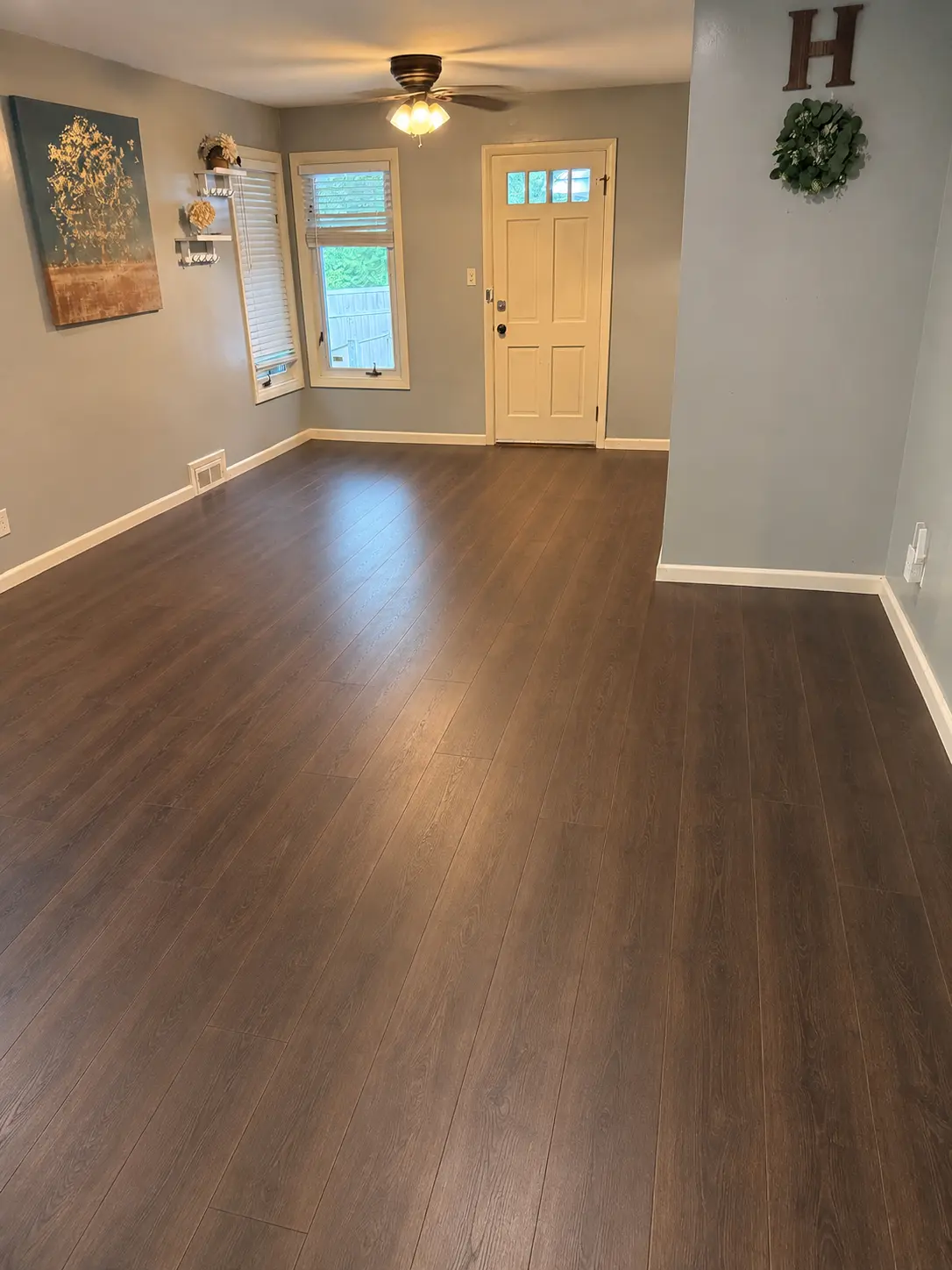 Completed warm-tone flooring in a living room