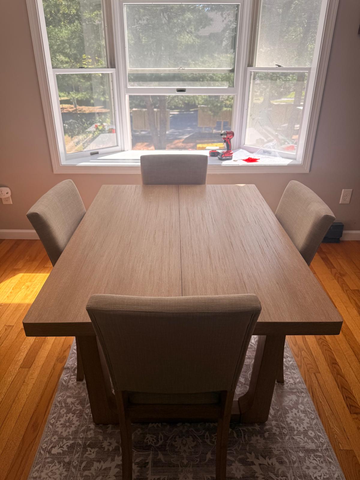 Hardwood flooring in a dining room beneath a table and chairs