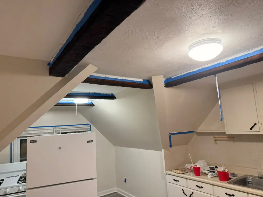 Kitchen cabinets and surfaces protected during painting
